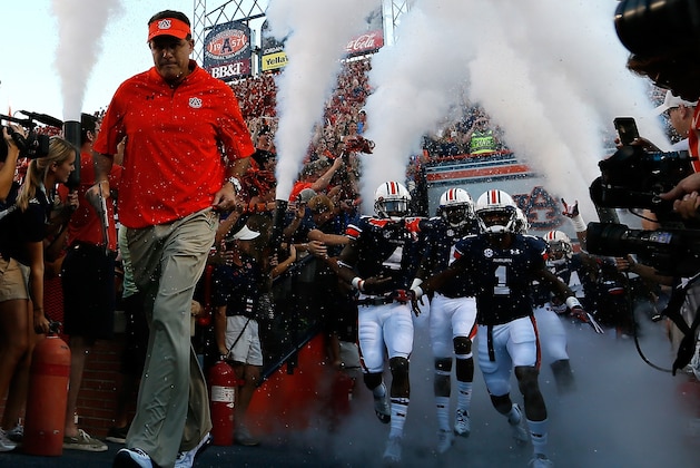 AUBURN, AL - SEPTEMBER 14: Head coach Gus Malzahn of the Auburn Tigers leads his team onto the field to face the Mississippi State Bulldogs at Jordan-Hare Stadium on September 14, 2013 in Auburn, Alabama. (Photo by Kevin C. Cox/Getty Images) AUBURN, AL - SEPTEMBER 14: Head coach Gus Malzahn of the Auburn Tigers leads his team onto the field to face the Mississippi State Bulldogs at Jordan-Hare Stadium on September 14, 2013 in Auburn, Alabama. (Photo by Kevin C. Cox/Getty Images)
