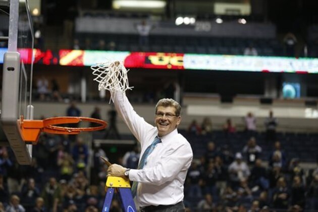 Connecticut head coach Geno Auriemma holds the net after the second half of the championship game against Notre Dame in the Final Four of the NCAA women's college basketball tournament, Tuesday, April 8, 2014, in Nashville, Tenn. Connecticut won 79-58.  (AP Photo/John Bazemore)