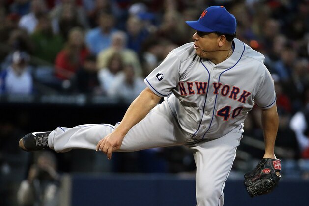 New York Mets starting pitcher Bartolo Colon throws in the first inning of baseball game against the Atlanta Braves, Tuesday, April 8, 2014, in Atlanta. (AP Photo/David Goldman)