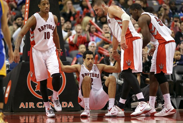 Mar 2, 2014; Toronto, Ontario, CAN; Toronto Raptors forward Landry Fields (2) is helped up by guard DeMar DeRozan (10) and center Jonas Valanciunas (17) and forward Patrick Patterson (54) against the Golden State Warriors at Air Canada Centre. The Raptors beat the Warriors 104-98. Mandatory Credit: Tom Szczerbowski-USA TODAY Sports Mar 2, 2014; Toronto, Ontario, CAN; Toronto Raptors forward Landry Fields (2) is helped up by guard DeMar DeRozan (10) and center Jonas Valanciunas (17) and forward Patrick Patterson (54) against the Golden State Warriors at Air Canada Centre. The Raptors beat the Warriors 104-98. Mandatory Credit: Tom Szczerbowski-USA TODAY Sports