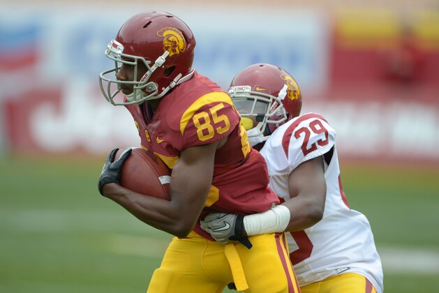 Apr 13, 2013; Los Angeles, CA, USA; Southern California Trojans receiver Victor Blackwell (85) is tackled by cornerback Chris Hawkins (29) during the spring game at the Los Angeles Memorial Coliseum. Mandatory Credit: Kirby Lee-USA TODAY Sports