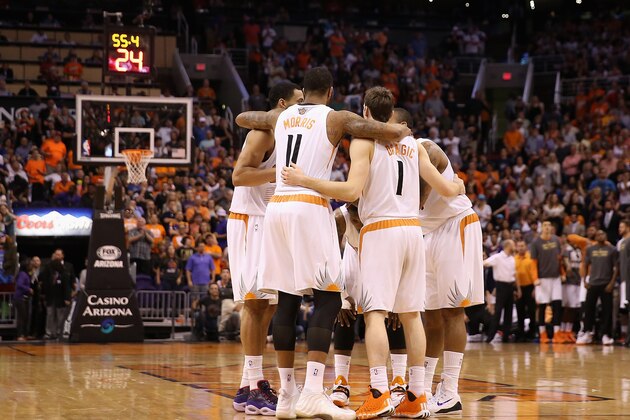 PHOENIX, AZ - APRIL 06:  The Phoenix Suns huddle up during the NBA game against the Oklahoma City Thunder at US Airways Center on April 6, 2014 in Phoenix, Arizona.  The Suns defeated the Thunder 122-115. NOTE TO USER: User expressly acknowledges and agrees that, by downloading and or using this photograph, User is consenting to the terms and conditions of the Getty Images License Agreement.  (Photo by Christian Petersen/Getty Images)