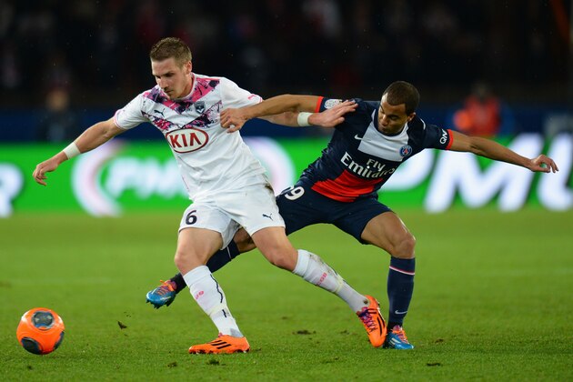 PARIS, FRANCE - JANUARY 31:  Gregory Sertic of Girondins de Bordeaux is challenged by Lucas Rodrigues Da Silva of Paris Saint-Germain FC during the Ligue 1 match between Paris Saint-Germain FC and FC Girondins de Bordeaux at Parc des Princes on January 31, 2014 in Paris, France.  (Photo by Shaun Botterill/Getty Images)