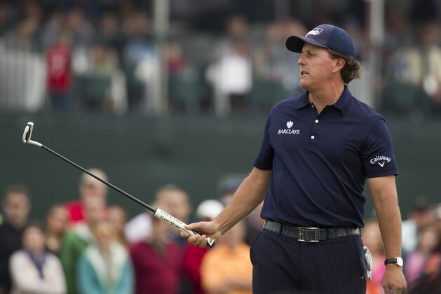 Phil Mickelson watches his putt on the 18th green during the third round of the Houston Open golf tournament on Saturday, April 5, 2014, in Humble, Texas. (AP Photo/Patric Schneider)