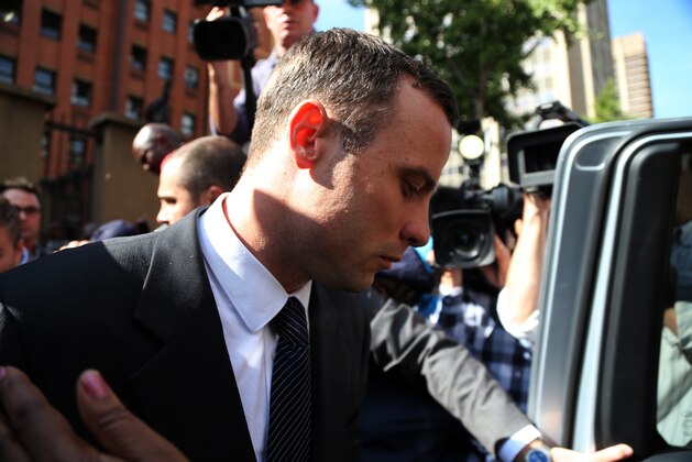 Oscar Pistorius, leaves the high court in Pretoria, South Africa, Tuesday, April 8, 2014. Pistorius is charged with murder for the shooting death of his girlfriend, Reeva Steenkamp, on Valentines Day in 2013. (AP Photo/Themba Hadebe)