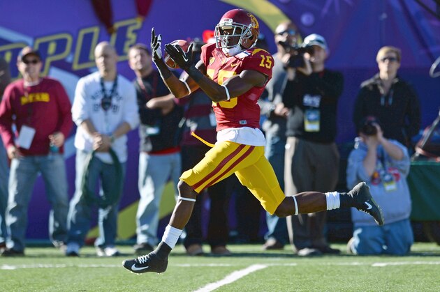 LAS VEGAS, NV - DECEMBER 21:  Nelson Agholor #15 of the USC Trojans catches a pass on a 40-yard play for a touchdown against the Fresno State Bulldogs during the Royal Purple Las Vegas Bowl at Sam Boyd Stadium on December 21, 2013 in Las Vegas, Nevada.  (Photo by Ethan Miller/Getty Images)