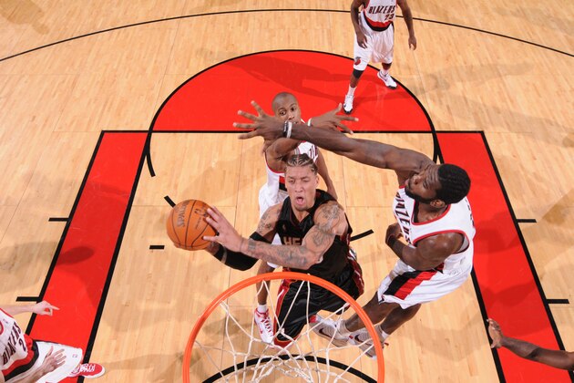 PORTLAND, OR - DECEMBER 1: Michael Beasley #30 of the Miami Heat goes up for a shot around Greg Oden #52 of the Portland Trail Blazers during a game on December 1, 2009 at the Rose Garden Arena in Portland, Oregon. NOTE TO USER: User expressly acknowledges and agrees that, by downloading and or using this photograph, User is consenting to the terms and conditions of the Getty Images License Agreement. Mandatory Copyright Notice: Copyright 2009 NBAE (Photo by Sam Forencich/NBAE via Getty Images)