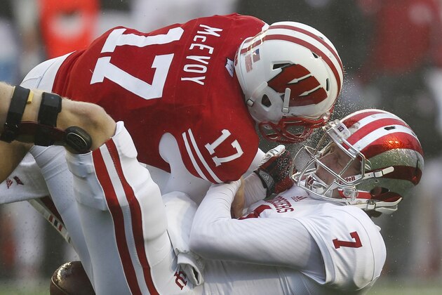 Indiana quarterback Nate Sudfeld (7) fumbles against Wisconsin's Tanner McEvoy during the first half of a college football game Saturday, Nov. 16, 2013, in Madison, Wis. Indiana recovered the fumble. (AP Photo/Andy Manis)