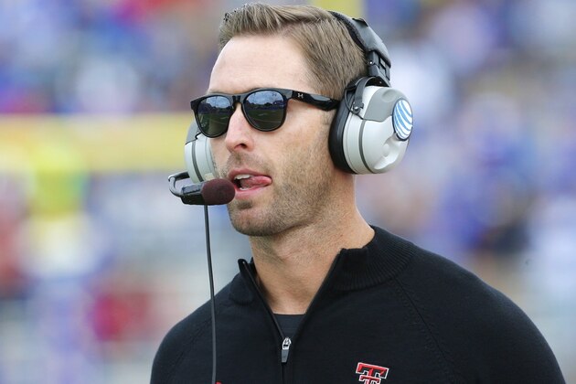 Texas Tech head coach Kliff Kingsbury tosses a ball before an NCAA college football game against Southern Methodist Friday, Aug. 30, 2013, in Dallas. Texas Tech won 41-23. (AP Photo/LM Otero)