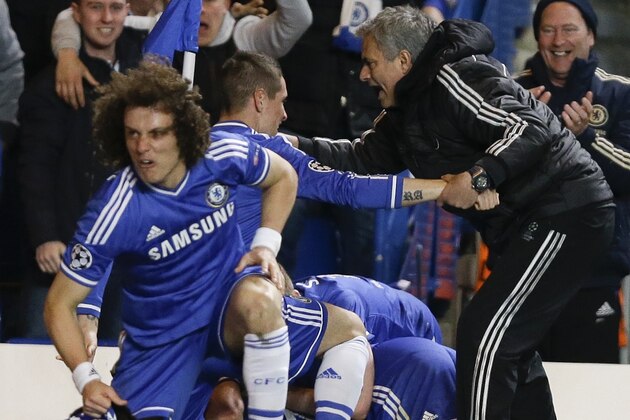 Chelsea's manager Jose Mourinho, right, celebrates with his team after Demba Ba scores the winning goal during the Champions League second leg quarterfinal soccer match between Chelsea and Paris Saint-Germain at Stamford Bridge Stadium in London, Tuesday, April 8, 2014. (AP Photo/Kirsty Wigglesworth) Chelsea's manager Jose Mourinho, right, celebrates with his team after Demba Ba scores the winning goal during the Champions League second leg quarterfinal soccer match between Chelsea and Paris Saint-Germain at Stamford Bridge Stadium in London, Tuesday, April 8, 2014. (AP Photo/Kirsty Wigglesworth)