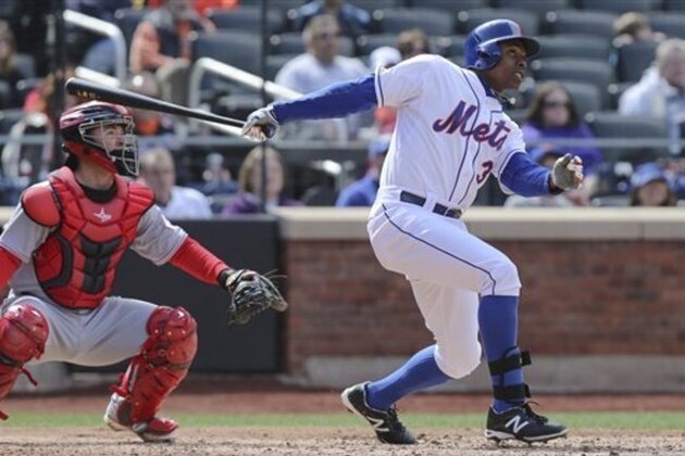 New York Mets right fielder Curtis Granderson (3) hits a two-run home run in the seventh inning of their baseball game against the Cincinnati Reds at Citi Field, Saturday, April 5, 2014, in New York. The Mets won, 6-3.  (AP Photo/John Minchillo)
