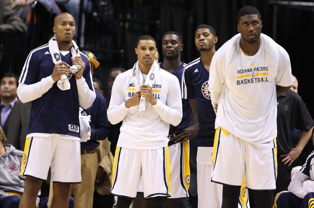 Nov 11, 2013; Indianapolis, IN, USA; Indiana Pacers from left to right forward David West, guard George Hill, guard Lance Stephenson, forward Paul George, and center Roy Hibbert watch the Pacers extend their winning streak to 8-0 against the Memphis Grizzlies at Bankers Life Fieldhouse. Indiana defeats Memphis 95-79. Mandatory Credit: Brian Spurlock-USA TODAY Sports