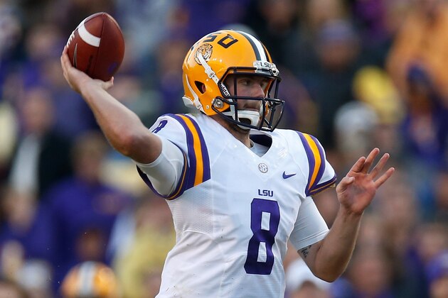 BATON ROUGE, LA - NOVEMBER 29:  Quarterback Zach Mettenberger #8 of the LSU Tigers throws a a pass against the Arkansas Razorbacks at Tiger Stadium on November 29, 2013 in Baton Rouge, Louisiana.  (Photo by Chris Graythen/Getty Images)