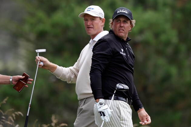 PEBBLE BEACH, CA - JUNE 20:  Phil Mickelson (R) watches his tee shot on the second hole as Ernie Els of South Africa looks on during the final round of the 110th U.S. Open at Pebble Beach Golf Links on June 20, 2010 in Pebble Beach, California.  (Photo by Donald Miralle/Getty Images)