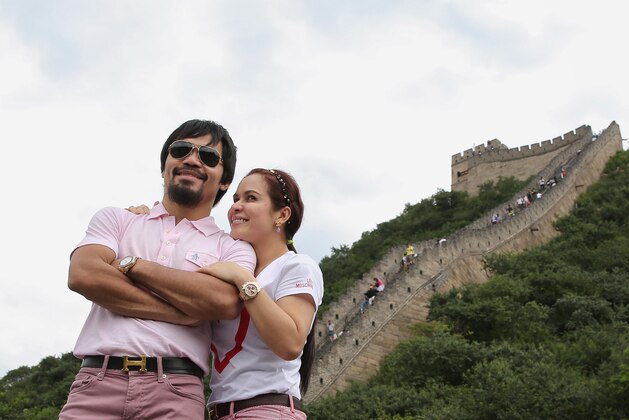 BEIJING, CHINA - JULY 29:  World boxing icon Manny Pacquiao and his wife Jinkee visit to the Great Wall on July 29, 2013 in Beijing, China. Manny Pacquiao and Brandon Rios will embark on a 23,722-mile media tour around world.  (Photo by Feng Li/Getty Images)