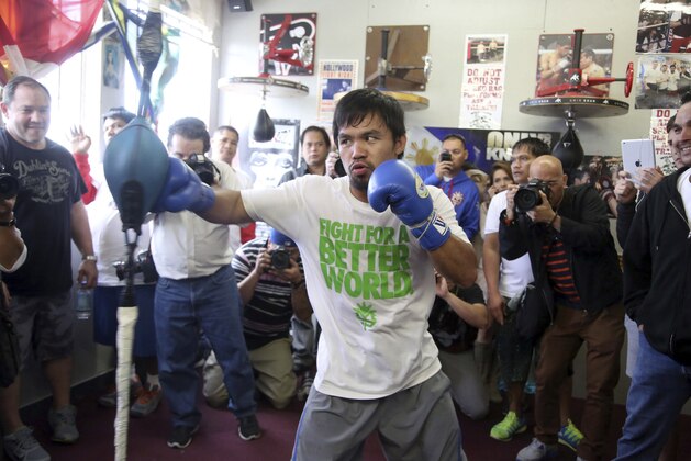 Manny Pacquiao trains on Wednesday, April 2, 2014, at the Wild Card Boxing Club in Los Angeles. Pacquiao is scheduled to fight Timothy Bradley on April 12 in a WBO welterweight title bout. (AP Photo/Nick Ut)