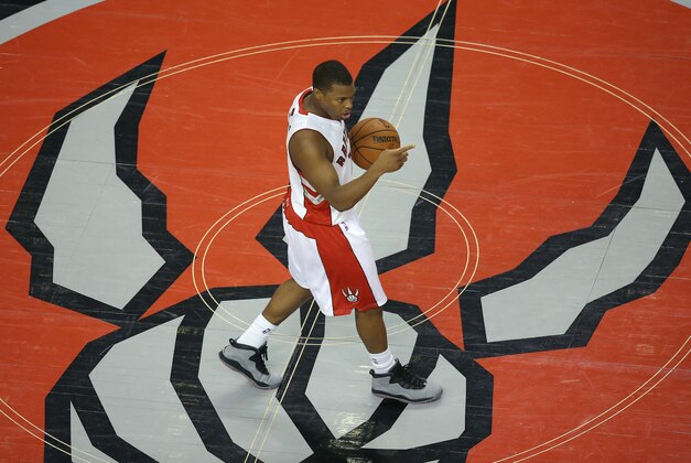 Mar 21, 2014; Toronto, Ontario, CAN; Toronto Raptors point guard Kyle Lowry (7) brings the ball up the court against the Oklahoma City Thunder at Air Canada Centre. Mandatory Credit: Tom Szczerbowski-USA TODAY Sports
