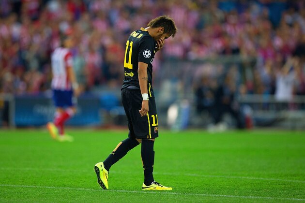 MADRID, SPAIN - APRIL 09:  A dejected Neymar of Barcelona at the final whistle during the UEFA Champions League Quarter Final second leg match between Club Atletico de Madrid and FC Barcelona at Vicente Calderon Stadium on April 9, 2014 in Madrid, Spain.  (Photo by Gonzalo Arroyo Moreno/Getty Images)