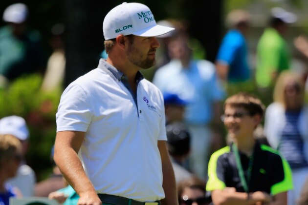 AUGUSTA, GA - APRIL 09:  Ryan Moore of the United States waits with his son Tucker during the Par Three Contest prior to the start of the 2014 Masters Tournament at Augusta National Golf Club on April 9, 2014 in Augusta, Georgia.  (Photo by Rob Carr/Getty Images)