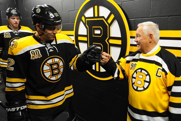 BOSTON, MA - MARCH 27: Jarome Iginla #12 of the Boston Bruins fist bumps alumni legend Johnny Bucyk before the game against the Chicago Blackhawks at the TD Garden on March 27, 2014 in Boston, Massachusetts.  (Photo by Steve Babineau/NHLI via Getty Images)