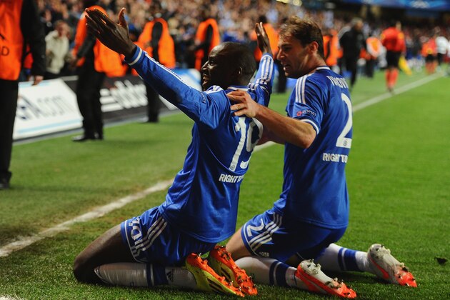 LONDON, ENGLAND - APRIL 08:  Demba Ba of Chelsea celebrates scoring their second goal with Branislav Ivanovic of Chelsea  during the UEFA Champions League Quarter Final second leg match between Chelsea and Paris Saint-Germain FC at Stamford Bridge on April 8, 2014 in London, England.  (Photo by Mike Hewitt/Getty Images)