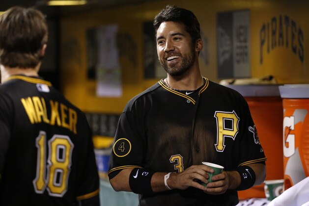 Pittsburgh Pirates' Travis Ishikawa, right, celebrates with teammates in the dugout after hitting a solo-home run off St. Louis Cardinals starting pitcher Shelby Miller during the fourth  inning of a baseball game in Pittsburgh Friday, April 4, 2014. It was Alvarez's second homer of the game. (AP Photo/Gene J. Puskar)