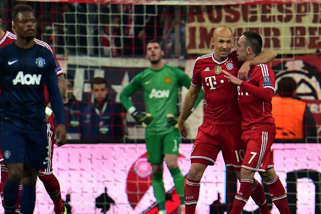Bayern's Arjen Robben of the Netherlands, second right, and his teammate Franck Ribery of France, right, celebrate their side's 2nd goal during the Champions League quarterfinal second leg soccer match between Bayern Munich and Manchester United in the Allianz Arena in Munich, Germany, Wednesday, April 9, 2014. (AP Photo/Kerstin Joensson)