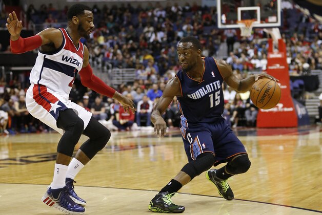 Apr 9, 2014; Washington, DC, USA; Charlotte Bobcats guard Kemba Walker (15) dribbles the ball as Washington Wizards guard John Wall (2) defends in the fourth quarter at Verizon Center. The Bobcats won 94-88 in overtime. Mandatory Credit: Geoff Burke-USA TODAY Sports Apr 9, 2014; Washington, DC, USA; Charlotte Bobcats guard Kemba Walker (15) dribbles the ball as Washington Wizards guard John Wall (2) defends in the fourth quarter at Verizon Center. The Bobcats won 94-88 in overtime. Mandatory Credit: Geoff Burke-USA TODAY Sports