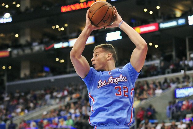 April 6, 2014; Los Angeles, CA, USA; Los Angeles Clippers forward Blake Griffin (32) grabs a rebound against the Los Angeles Lakers during the first half at Staples Center. Mandatory Credit: Gary A. Vasquez-USA TODAY Sports