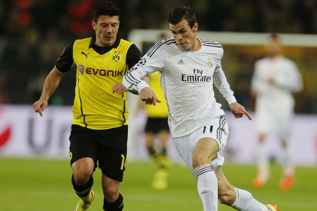 Dortmund's Milos Jojic, left, and Real's Gareth Bale challenge for the ball during the Champions League quarterfinal second leg soccer match between Borussia Dortmund and Real Madrid in the Signal Iduna stadium in Dortmund, Germany, Tuesday, April 8, 2014. (AP Photo/Frank Augstein) Dortmund's Milos Jojic, left, and Real's Gareth Bale challenge for the ball during the Champions League quarterfinal second leg soccer match between Borussia Dortmund and Real Madrid in the Signal Iduna stadium in Dortmund, Germany, Tuesday, April 8, 2014. (AP Photo/Frank Augstein)