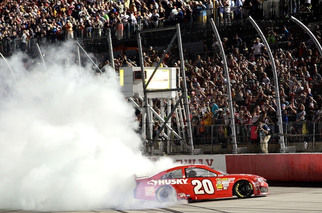 DARLINGTON, SC - MAY 11:  Matt Kenseth, driver of the #20 The Home Depot / Husky Toyota, performs a burnout in celebration of winning the NASCAR Sprint Cup Series Bojangles' Southern 500 at Darlington Raceway on May 11, 2013 in Darlington, South Carolina.  (Photo by Geoff Burke/Getty Images)