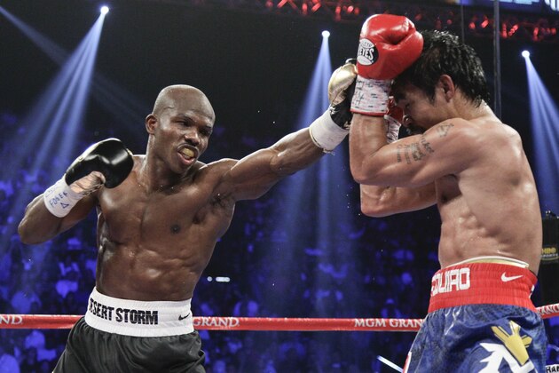 Timothy Bradley throws a punch against Manny Pacquiao in the eighth round of their WBO world welterweight title fight Saturday, June 9, 2012, in Las Vegas. (AP Photo/Julie Jacobson)