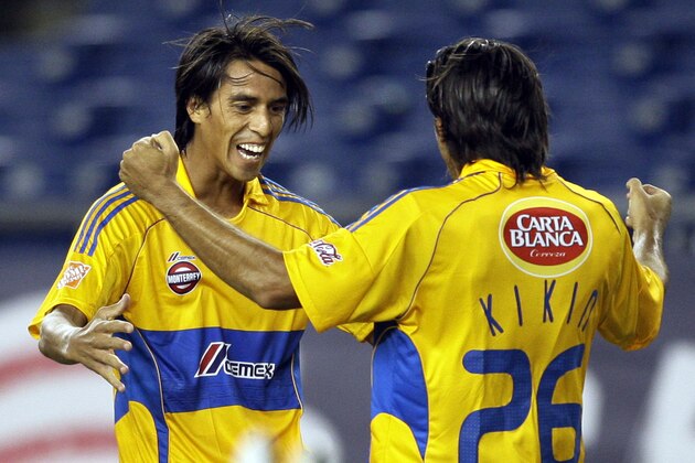 Tigres UANL's Lucas Lobos, left, celebrates with Jose Francisco Fonseca (26) after Fonseca's goal against Santos Laguna in the first half of a SuperLiga semifinal soccer match in Foxborough, Mass., Wednesday, July 15, 2009. (AP Photo/Elise Amendola)
