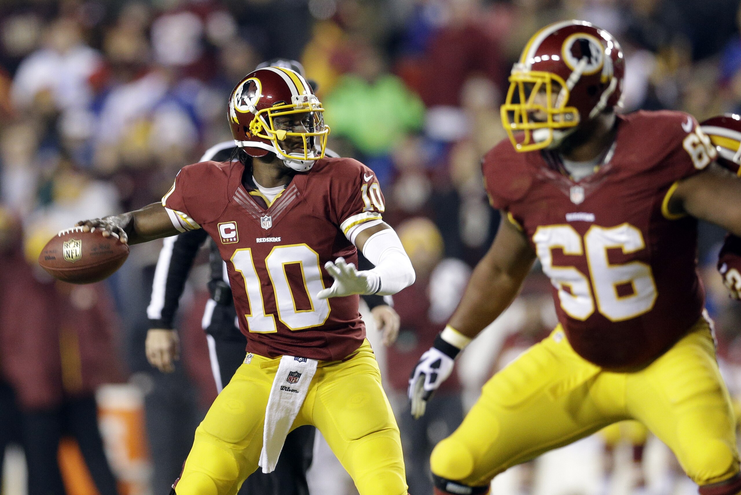 Washington Redskins quarterback Robert Griffin III (10) looks to pass with the protection of guard Chris Chester (66) during the first half of an NFL football game against the New York Giants Sunday, Dec. 1, 2013, in Landover, Md. (AP Photo/Patrick Semansky) Washington Redskins quarterback Robert Griffin III (10) looks to pass with the protection of guard Chris Chester (66) during the first half of an NFL football game against the New York Giants Sunday, Dec. 1, 2013, in Landover, Md. (AP Photo/Patrick Semansky)