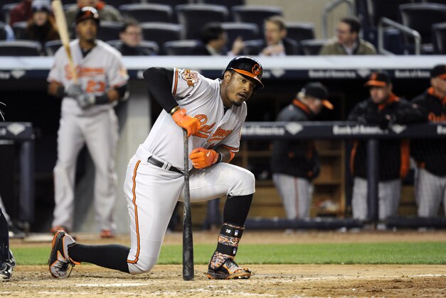 Baltimore Orioles' Adam Jones reacts after striking out  during the ninth inning of a baseball game against the New York Yankees Wednesday, April 9, 2014, at Yankee Stadium in New York. (AP Photo/Bill Kostroun)