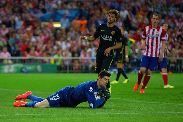 MADRID, SPAIN - APRIL 09:  Thibaut Courtois of Club Atletico de Madrid collects the ball during the UEFA Champions League Quarter Final second leg match between Club Atletico de Madrid and FC Barcelona at Vicente Calderon Stadium on April 9, 2014 in Madrid, Spain.  (Photo by Gonzalo Arroyo Moreno/Getty Images)