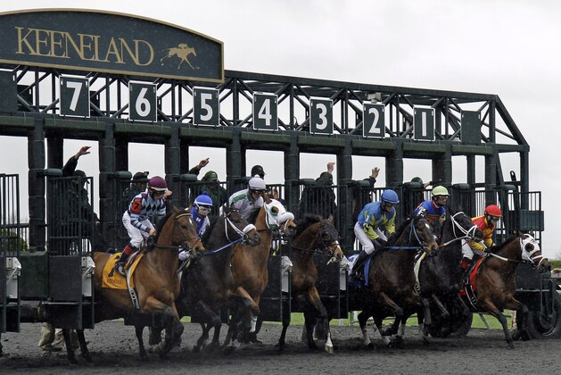 Thoroughbreds break from the starting game in the first horse race of opening day at Keeneland in Lexington, Ky., Friday, April 4, 2014. English Council (4), getting a late start, won the race. (AP Photo/Garry Jones)