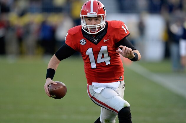 FILE - In this Nov. 30, 2013 file photo, Georgia quarterback Hutson Mason (14) scrambles for a first down against Georgia Tech during the first half of an NCAA football game in Atlanta. With the drama of his first career start behind him, Mason can use practice for No. 23 Georgia's Gator Bowl game against Nebraska as preparation for his expected full season as a starter in 2014. (AP Photo/David Tulis, File) FILE - In this Nov. 30, 2013 file photo, Georgia quarterback Hutson Mason (14) scrambles for a first down against Georgia Tech during the first half of an NCAA football game in Atlanta. With the drama of his first career start behind him, Mason can use practice for No. 23 Georgia's Gator Bowl game against Nebraska as preparation for his expected full season as a starter in 2014. (AP Photo/David Tulis, File)
