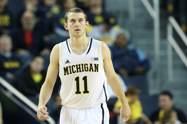 ANN ARBOR, MI - DECEMBER 07:  Nik Stauskas #11 of the University of Michigan Wolverines looks to the bench during the second half of the game against Houston Baptist Huskies at the Crisler Center on December 7, 2013 in Ann Arbor, Michigan. Michigan defeated Houston 107-53.  (Photo by Leon Halip/Getty Images)
