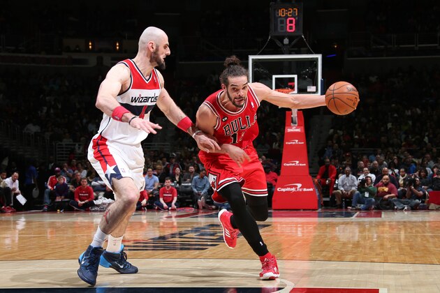 WASHINGTON, DC - APRIL 5: Joakim Noah #13 of the Chicago Bulls drives against Marcin Gortat #4 of the Washington Wizards at the Verizon Center on April 5, 2014 in Washington, DC. NOTE TO USER: User expressly acknowledges and agrees that, by downloading and or using this photograph, User is consenting to the terms and conditions of the Getty Images License Agreement. Mandatory Copyright Notice: Copyright 2014 NBAE (Photo by Ned Dishman/NBAE via Getty Images)