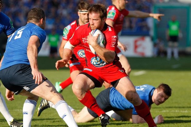 Leinster's Irish Full Back Rob Kearney, left,  tries to stop Toulon's hooker Craig Burden  of South Africa , center, who  runs past Leinster's Irish Centre Brian O'Driscol, bottom,  during their Heineken European Cup quarter final rugby match, at the Mayol stadium, in Toulon, southern France, Sunday, April 6, 2014. (AP Photo/Claude Paris)