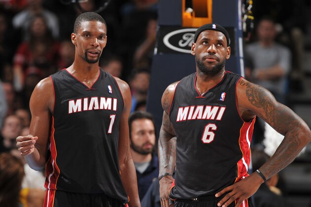 DENVER, CO - DECEMBER 30: Chris Bosh #1 and LeBron James #6 of the Miami Heat look on against the Denver Nuggets on December 30, 2013 at the Pepsi Center in Denver, Colorado. NOTE TO USER: User expressly acknowledges and agrees that, by downloading and/or using this Photograph, user is consenting to the terms and conditions of the Getty Images License Agreement. Mandatory Copyright Notice: Copyright 2013 NBAE (Photo by Garrett W. Ellwood/NBAE via Getty Images)
