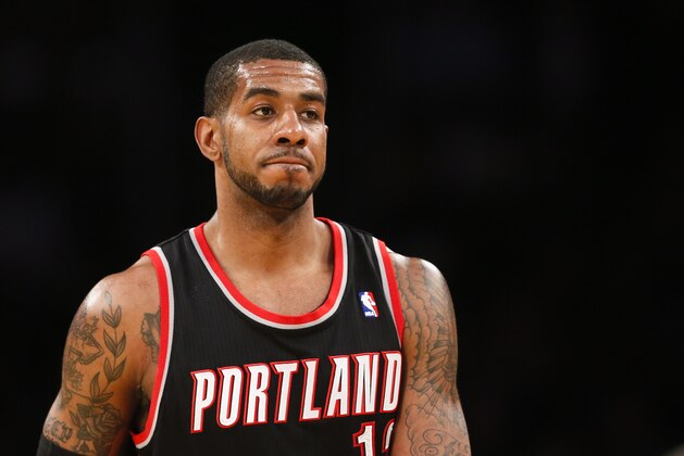Portland Trail Blazers forward LaMarcus Aldridge walks on the court against the Los Angeles Lakers during the first half of an NBA basketball game in Los Angeles, Tuesday, April 1, 2014. (AP Photo/Danny Moloshok)
