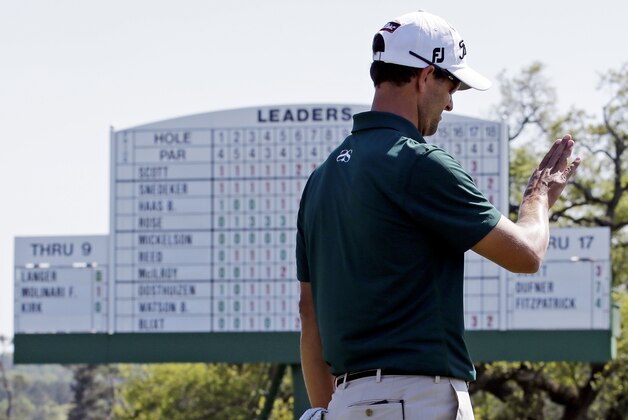 Adam Scott, of Australia, lines up his putt on the 18th green during the first round of the Masters golf tournament Thursday, April 10, 2014, in Augusta, Ga. (AP Photo/David J. Phillip)