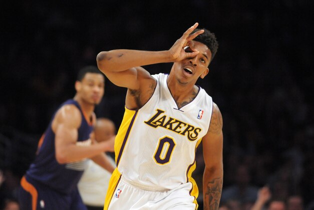 Mar 30, 2014; Los Angeles, CA, USA; Los Angeles Lakers guard Nick Young (0) celebrates after a 3-point basket against the Phoenix Suns at Staples Center. Mandatory Credit: Kirby Lee-USA TODAY Sports