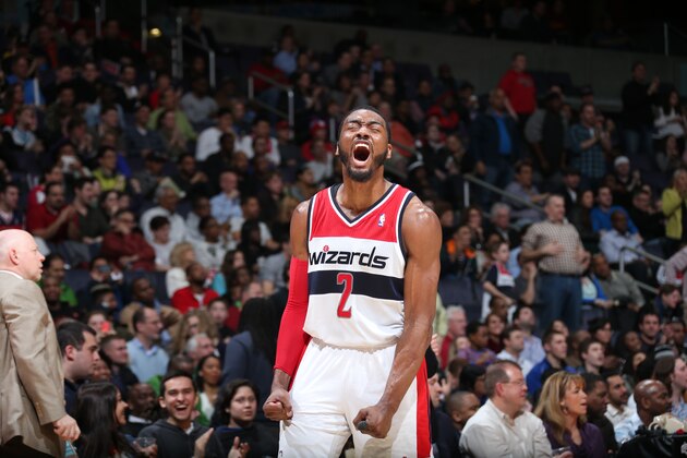 WASHINGTON, DC - MARCH 29: John Wall #2 of the Washington Wizards celebrates during a game against the Atlanta Hawks at the Verizon Center on March 29, 2014 in Washington, DC. NOTE TO USER: User expressly acknowledges and agrees that, by downloading and or using this photograph, User is consenting to the terms and conditions of the Getty Images License Agreement. Mandatory Copyright Notice: Copyright 2014 NBAE (Photo by Stephen Gosling/NBAE via Getty Images)