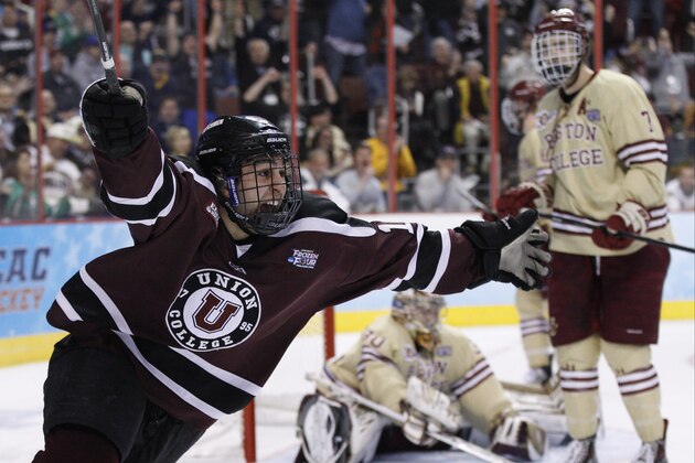 Union's Daniel Ciampini, left, reacts to his goal on Boston College's Thatcher Demko, center, with Isaac MacLeod, right, beside Demko during the second period of an NCAA men's college hockey Frozen Four tournament semfinal, Thursday, April 10, 2014, in Philadelphia. (AP Photo/Chris Szagola)