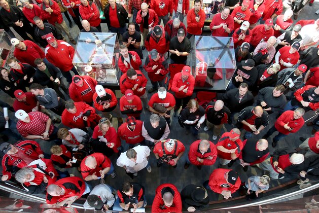 Georgia fans crowd the atrium as coach Mark Richt (not pictured) answers questions about Georgia's recruiting class on national signing day Wednesday, Feb. 5, 2014, in Athens, Ga. (AP Photo/Jason Getz)