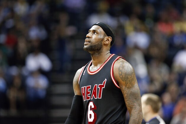 Miami Heat forward LeBron James plays against the Memphis Grizzlies in the second half of an NBA basketball game Wednesday, April 9, 2014, in Memphis, Tenn. The Grizzlies won 107-102. (AP Photo/Mark Humphrey)