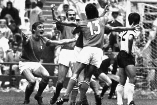 Italy's Roberto Boninsegna, obscured by team-mates, who scored a goal for his  team in the Football World Cup semi-final match against West Germany in Mexico City, Mexico on June 17, 1970. Left to right ; Italy's Gigi Riva, Sandro Mazzola and Angelo Domenghini, No.13, and West Germany's Wolfgang Overath. Italy defeated West Germany 4-3 after extra time. (AP Photo)